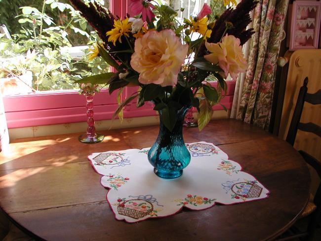 Gorgeous table centre with lovely embroidered baskets of flowers