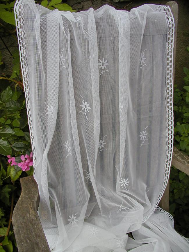 Lovely pair of net curtain, with floral pattern, ready to be hanged