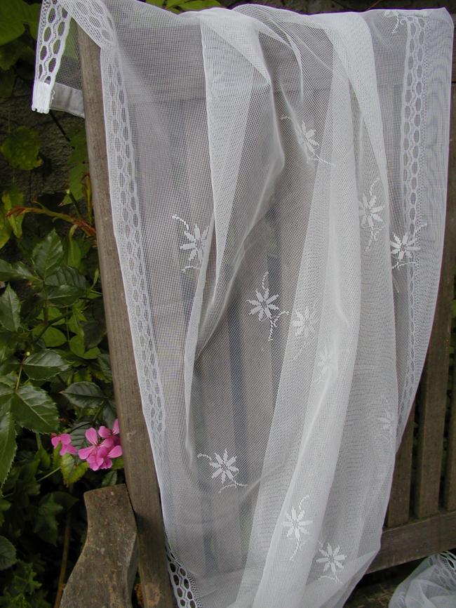 Lovely pair of net curtain, with floral pattern, ready to be hanged
