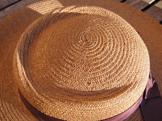 So charming woman straw hat with aubergine large ribbon 1930