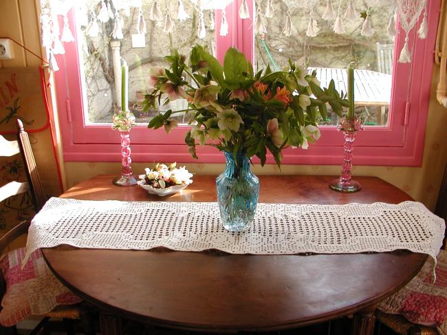 Lovely long table runner in crochet lace depicting flowers