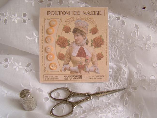 Lovely card with 6 antique engraved buttons in mother of pearl, peach color