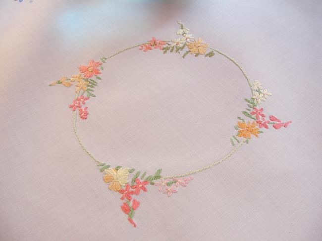 Really romantic tablecloth with embroidered summer flowers in a garden
