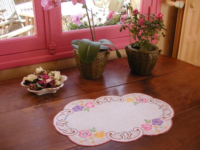 Really pretty table centre with rich embroidered floral border