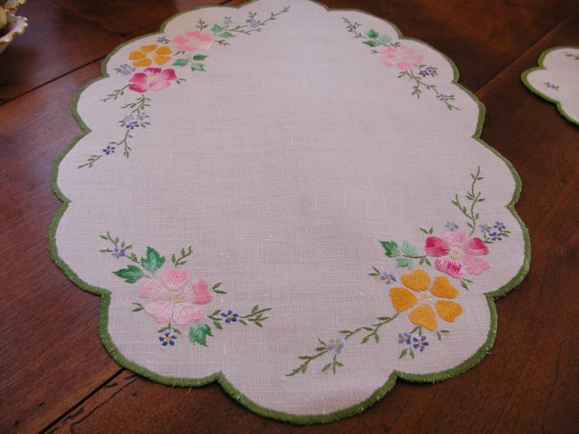Romantic set with a table centre with hand-embroidered flowers, acidulous colors