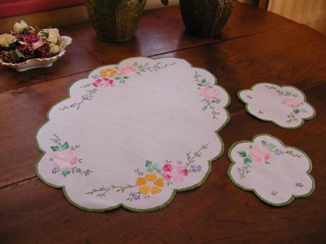 Romantic set with a table centre with hand-embroidered flowers, acidulous colors