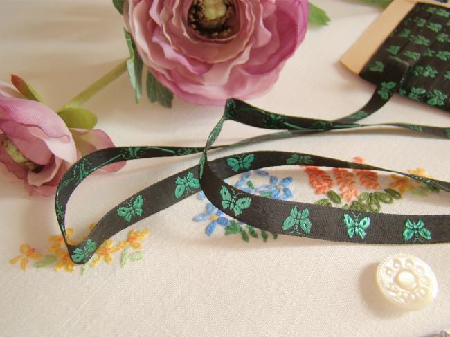 Lovely old little ribbon in black with vowen butterflies in green, width 10mm