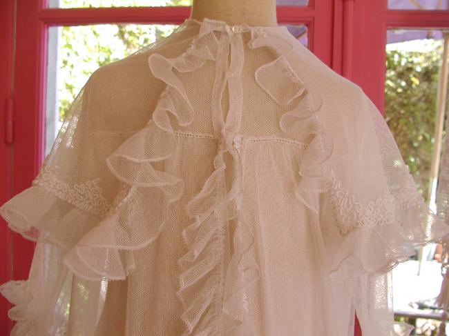 Gorgeous baby coat in net with hand-embroidery and flounces 1900