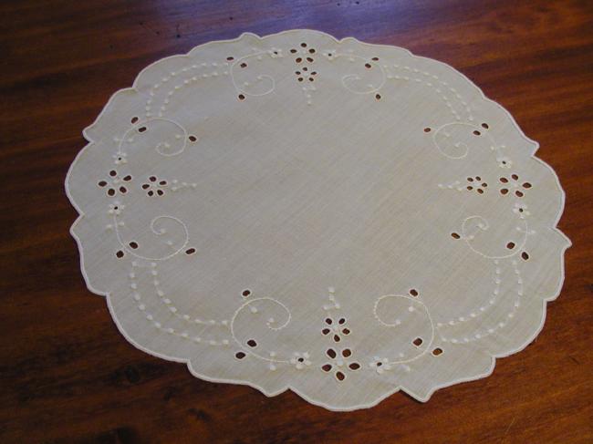 Romantic doily with embroidered flowers