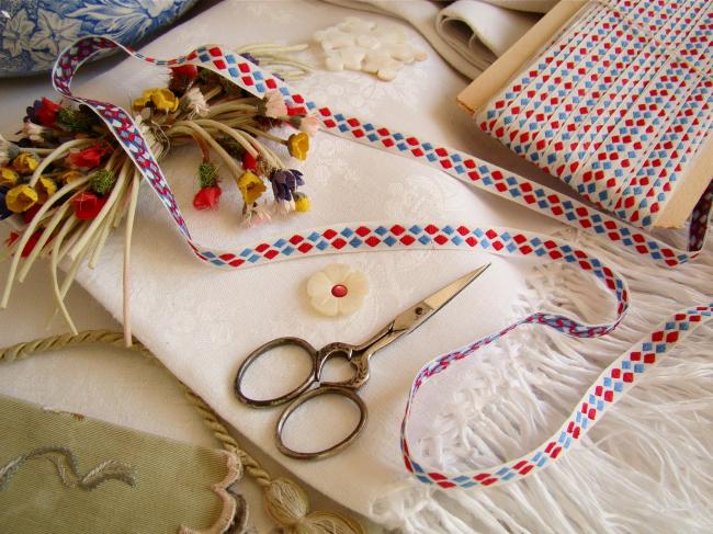 Adorable old little ribbon with vowen in blue, white and red, width 10mm