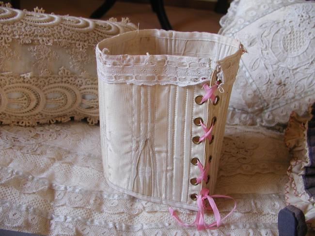 Lovely little corset for doll in ivory silk with rubans and lace