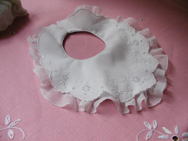 Adorable double baby bib with hand embroidered flowers and net lace