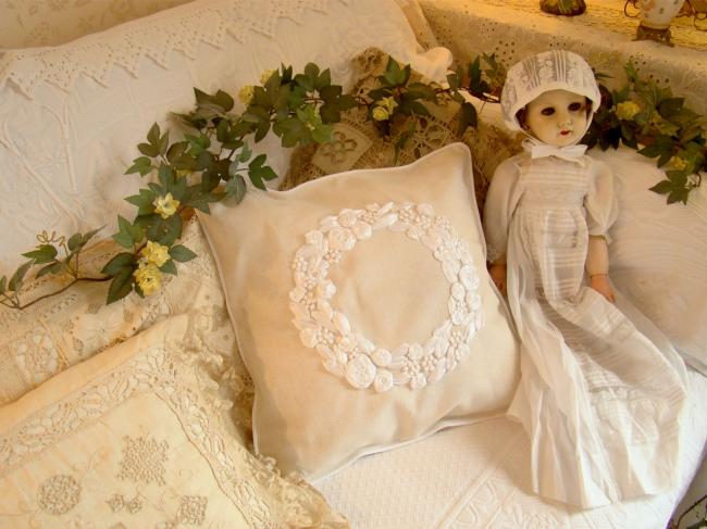 Romantic cushion cover with hand-embroidered crown of roses in ribbon