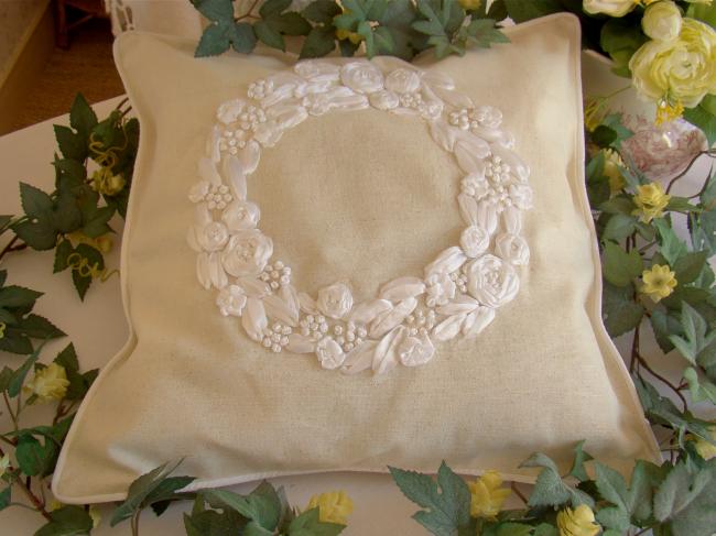 Romantic cushion cover with hand-embroidered crown of roses in ribbon