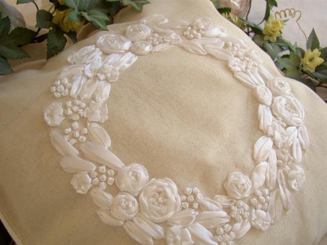 Romantic cushion cover with hand-embroidered crown of roses in ribbon