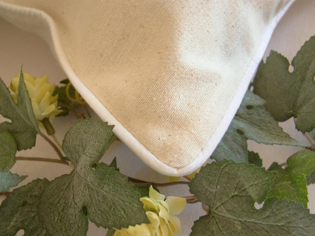 Romantic cushion cover with hand-embroidered crown of roses in ribbon