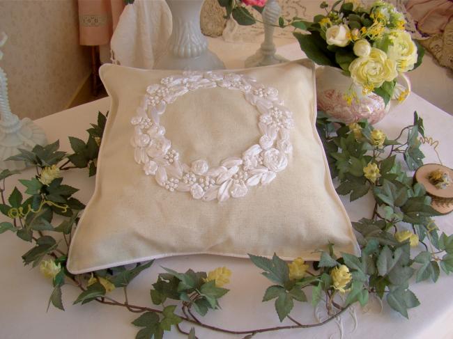 Romantic cushion cover with hand-embroidered crown of roses in ribbon