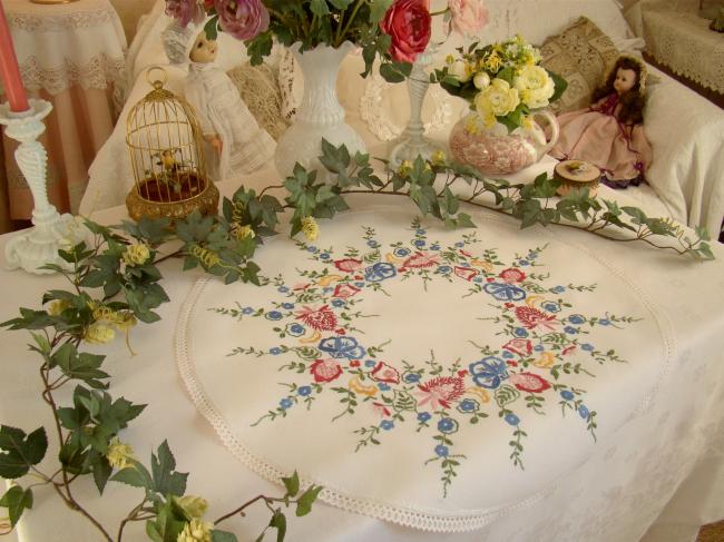 Gorgeous table centre with hand-embroidered flowers and lace edging