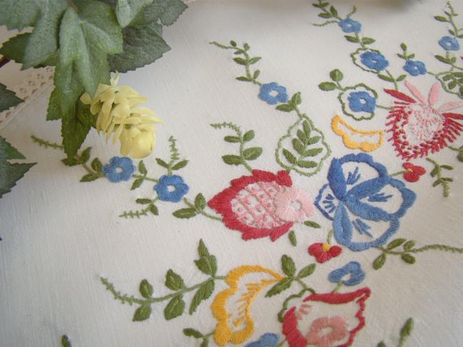 Gorgeous table centre with hand-embroidered flowers and lace edging