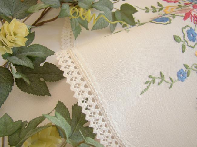 Gorgeous table centre with hand-embroidered flowers and lace edging