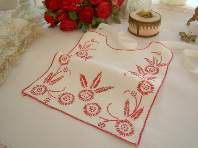 Lovely large bib with embroidered flowers in red