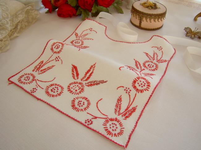 Lovely large bib with embroidered flowers in red