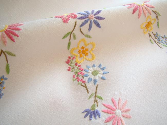 Breathtaking tablecloth with hand-embroidered garland of spring flowers