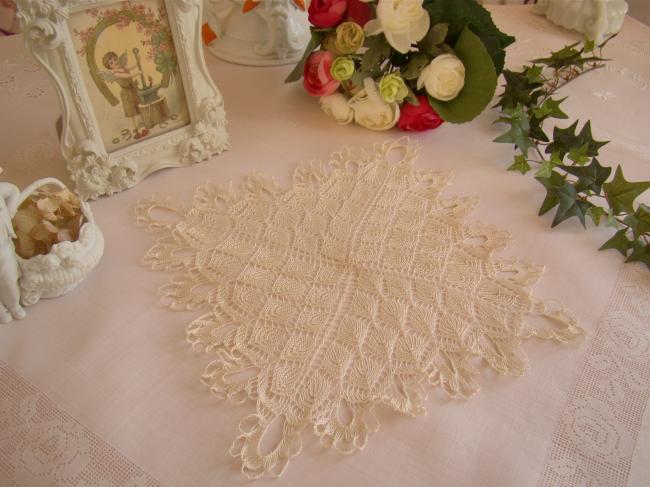 Lovely doily in very fine hand- knitted lace
