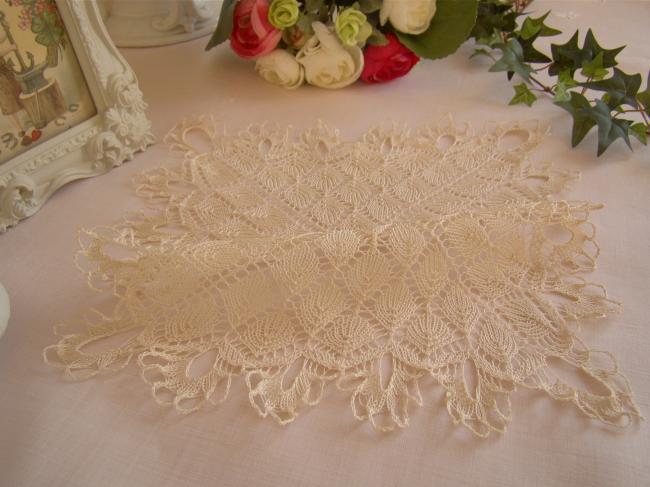 Lovely doily in very fine hand- knitted lace