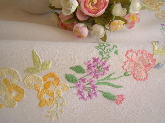 Breathtaking tablecloth with hand-embroidered garland of spring flowers