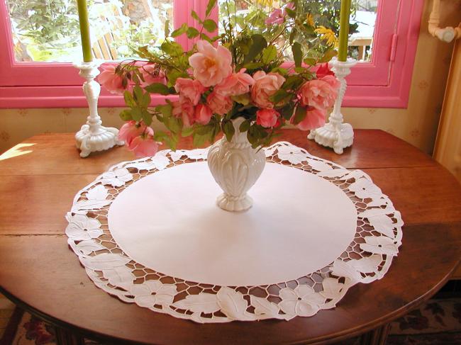 Gorgeous table centre with Richelieu openwork with stylish flowers and foliage
