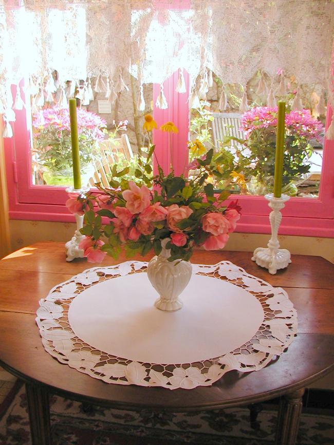 Gorgeous table centre with Richelieu openwork with stylish flowers and foliage