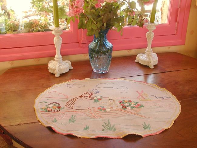 Adorable table centre with hand-embroidered lady in a boat in Holland