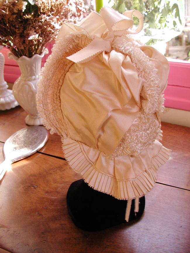 Exceptional baby bonnet-hat  in ivory silk, ribbon and bouclette of silk  1880