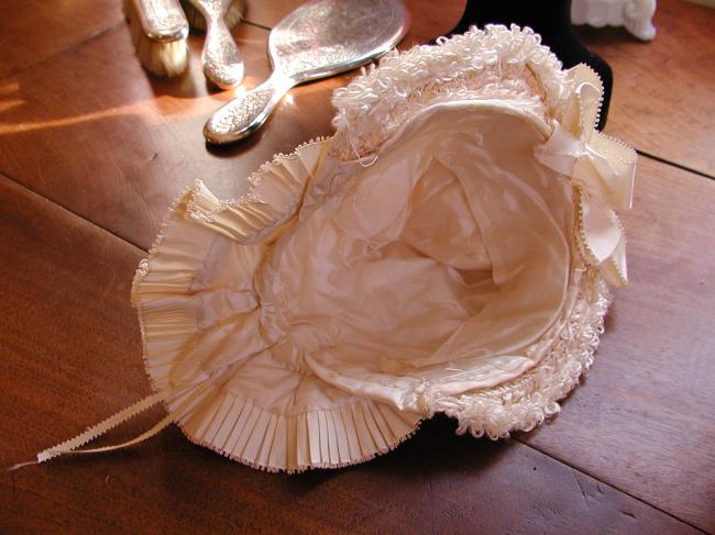 Exceptional baby bonnet-hat  in ivory silk, ribbon and bouclette of silk  1880