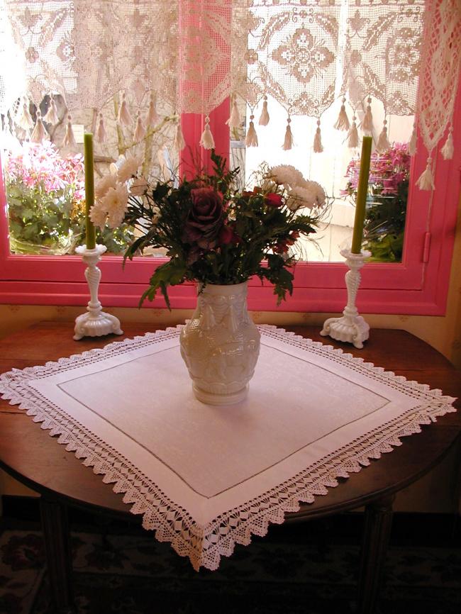 Gorgeous table centre in damask  of flowers with lovely hand-made lace