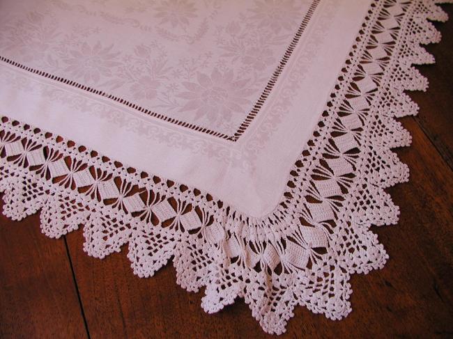 Gorgeous table centre in damask  of flowers with lovely hand-made lace