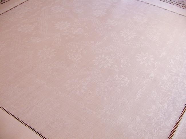Gorgeous table centre in damask  of flowers with lovely hand-made lace