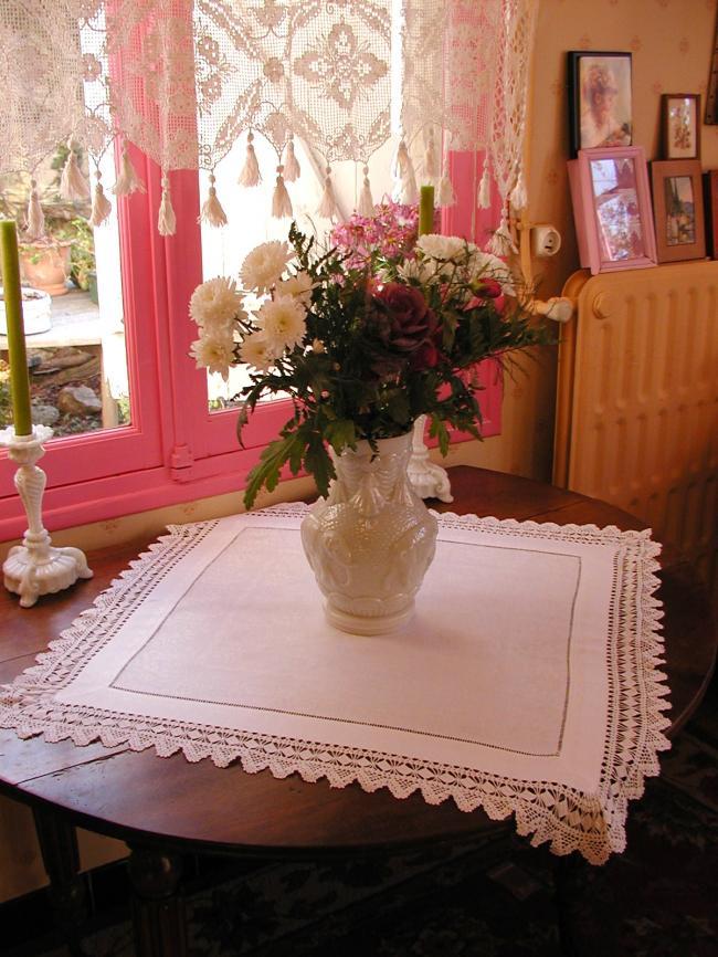 Gorgeous table centre in damask  of flowers with lovely hand-made lace