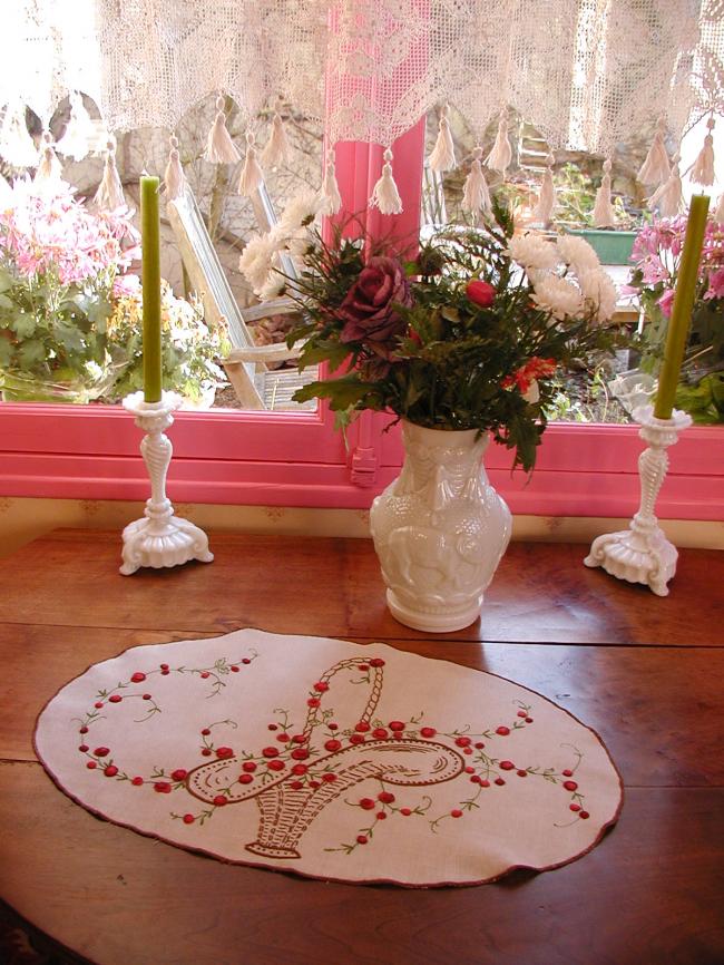 Really beautiful oval table centre with embroidered basket of red roses