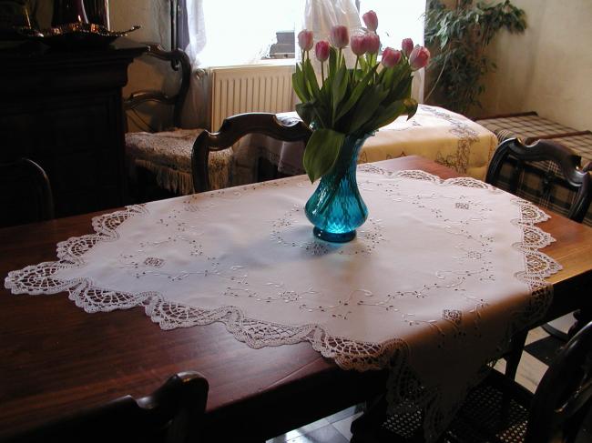 Gorgeous tablecloth with embroidered garland of flowers and Cluny lace.