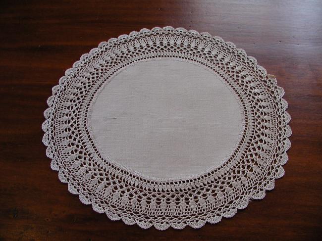 Very pretty little oval doily in guipere lace