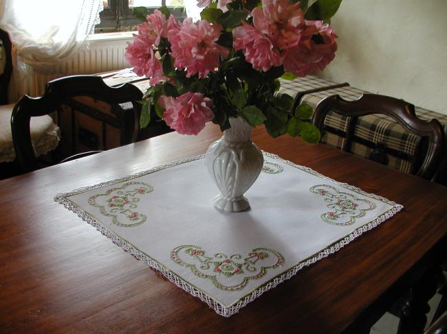 Very charming table centre with spring coloured embroideries