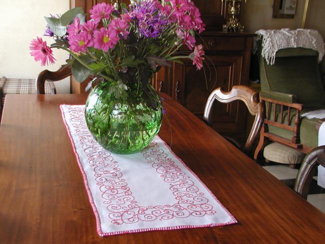 Lovely table runner with red embroidery.
