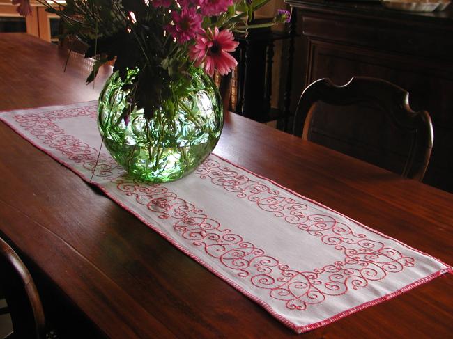Lovely table runner with red embroidery.