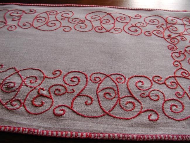 Lovely table runner with red embroidery.