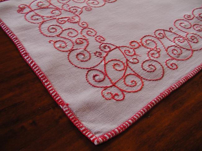 Lovely table runner with red embroidery.