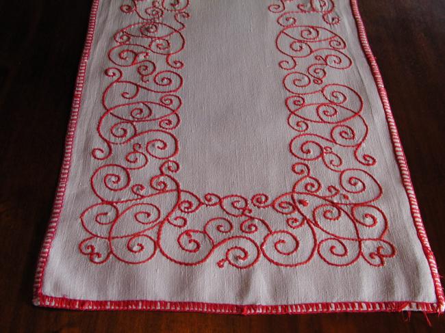 Lovely table runner with red embroidery.