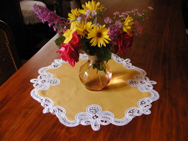 Stunning mustard table centre with battenburg tape lace edging