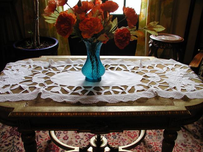 Exceptional table runner with baskets of flowers, lots of cutworks
